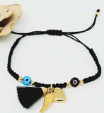Adjustable thread bracelet with Turkish eye, heart, wing and gold plate balls . Black